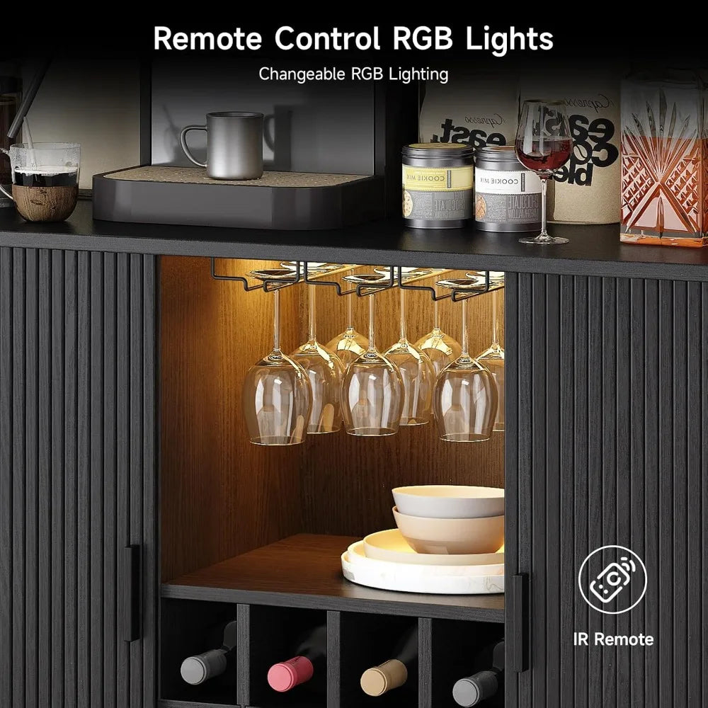 A dark wood and black cabinet with a wine rack and glass holder, shown lit from within by warm RGB lighting. The cabinet features a top shelf with cups and containers, a hanging wine glass rack with clear glasses, a middle shelf with stacked bowls and plates, and a lower wine storage section with bottles.