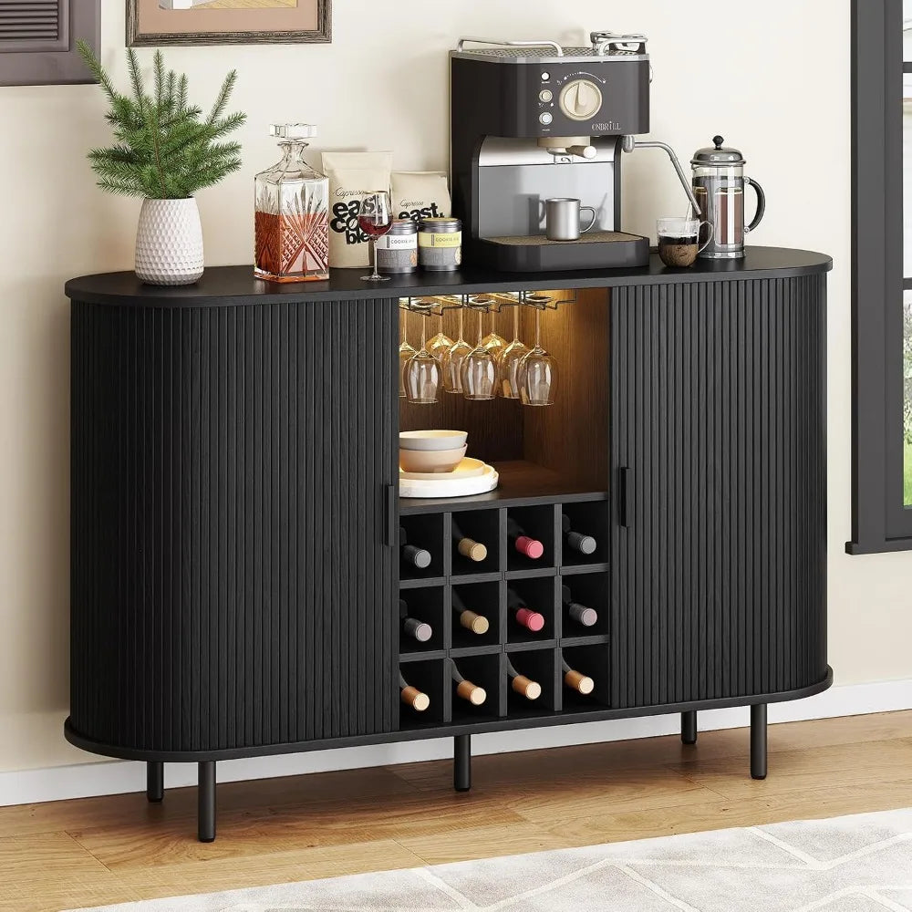 Black bar cabinet with wine storage and coffee-making equipment in a home setting.
