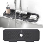 Black kitchen sink mat with a textured design on a white background