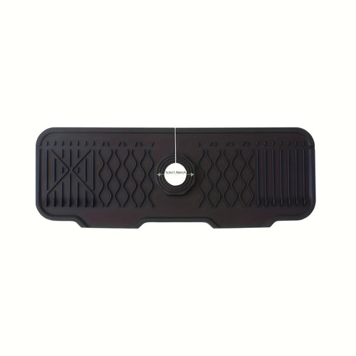 Black rubber mat with textured surface on a white background