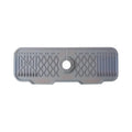 Gray rubber mat with textured surface and central hole on a white background