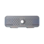 Gray rubber mat with textured surface and central hole on a white background