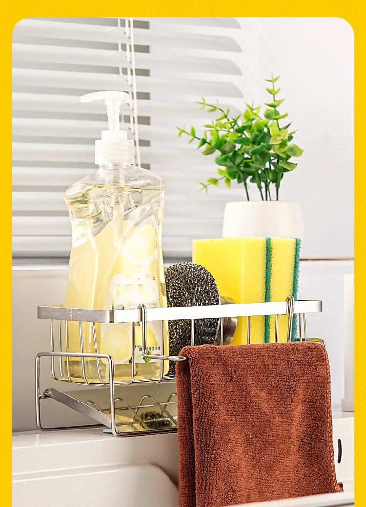 Kitchen rack with soap, sponge, and towel against a window with blinds.