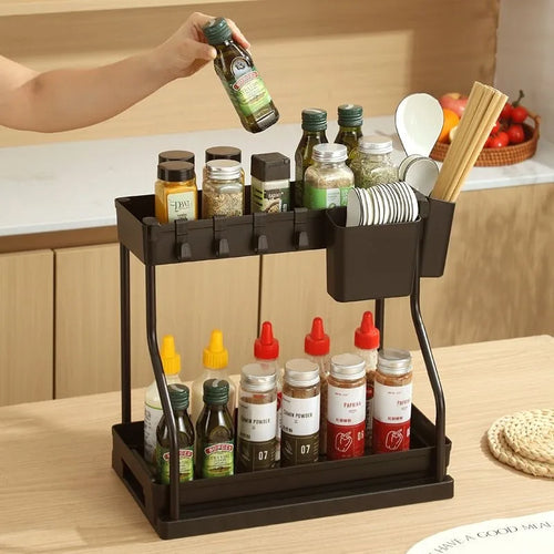 Sinkelle.com Black kitchen organizer with various bottles and utensils on a wooden countertop.