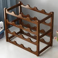 Wooden wine rack on a white surface with a gray curtain background