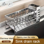 Stainless steel sink drain rack on a kitchen counter with text indicating its features.